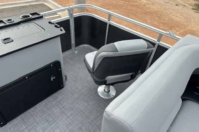 Slide: The Image of 2027 Sun Tracker SportFish 22 DLX boat interior with seating and control panel. - 24