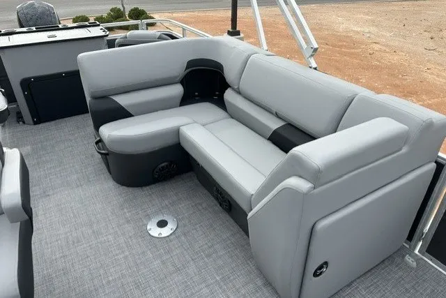 Slide: The Image of 2027 Sun Tracker SportFish 22 DLX pontoon boat with gray seating and spacious deck. - 17