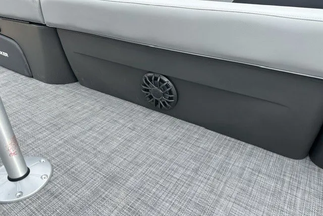 Slide: The Image of 2027 Sun Tracker SportFish 22 DLX interior with speaker and gray flooring. - 16