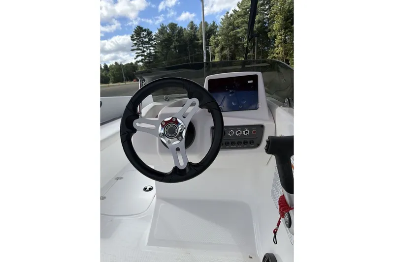 Slide: The Image of Steering console of 2027 Tahoe T16 boat with modern controls and display. - 10