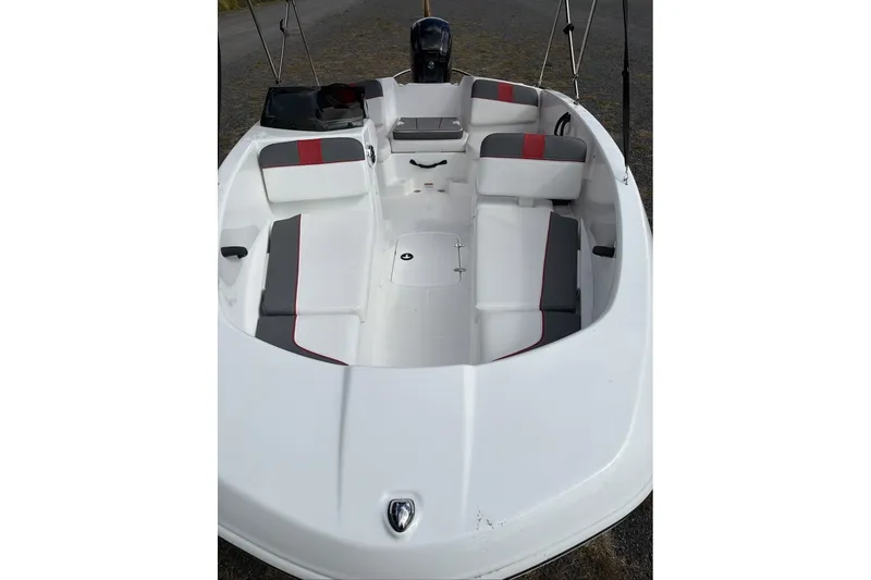 Slide: The Image of 2027 Tahoe T16 boat interior with white and red seating, showcasing spacious design. - 8