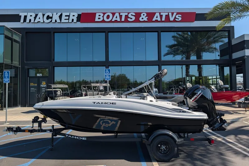 Slide: The Image of 2027 Tahoe T16 boat displayed at Tracker Boats & ATVs dealership. - 1