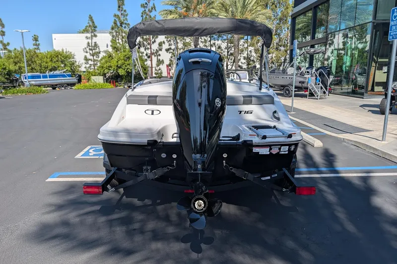Slide: The Image of 2027 Tahoe T16 boat with outboard motor in a parking lot. - 5