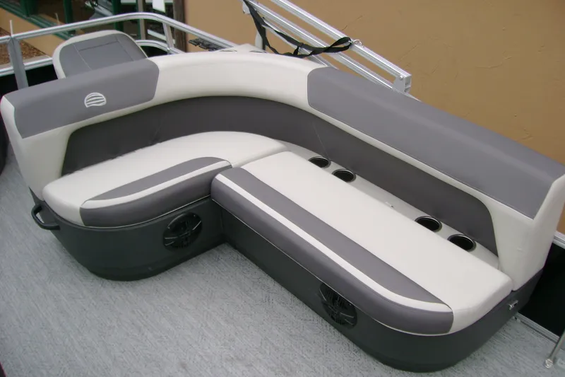 Slide: The Image of 2027 Sun Tracker Bass Buggy 18 DLX boat seating, featuring gray and white cushioned design. - 13