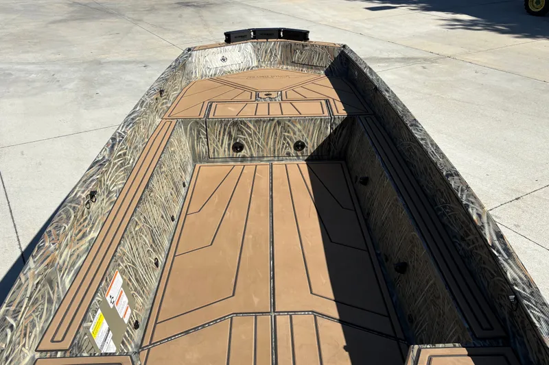 Slide: The Image of 2027 Tracker Grizzly 1650 T Prairie Wings Edition boat with camouflage interior design. - 22
