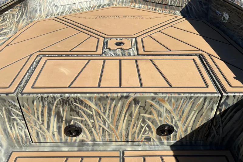 Slide: The Image of 2027 Tracker Grizzly 1650 T Prairie Wings Edition boat interior with camouflage design. - 25