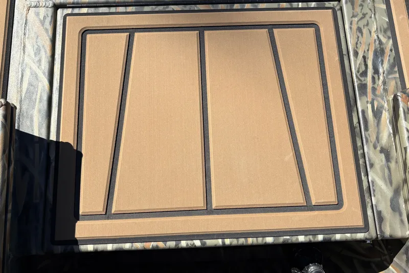 Slide: The Image of 2027 Tracker Grizzly 1650 T Prairie Wings Edition boat deck with camouflage pattern. - 17