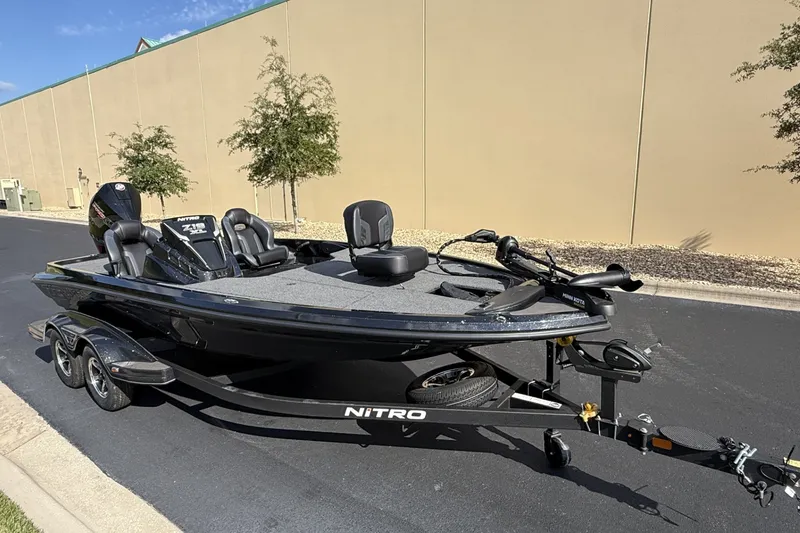 The Image of 2027 Nitro Z19 XL boat on trailer, parked outdoors. - 0