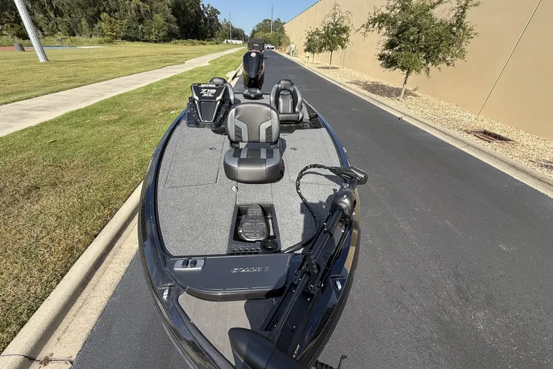Slide: The Image of 2027 Nitro Z19 XL boat parked on a road, showcasing sleek design and seating. - 3