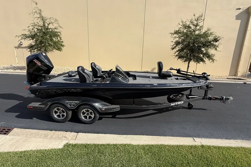 Slide: The Image of 2027 Nitro Z19 XL boat on trailer, parked outdoors. - 5