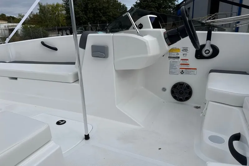 Slide: The Image of Interior view of a 2027 Tahoe T18 boat, featuring seating and steering console. - 4