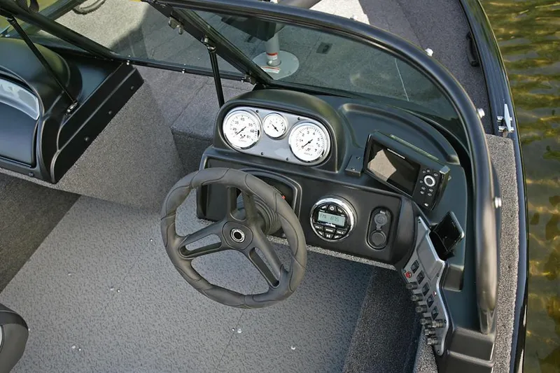 Slide: The Image of Manufacturer Provided Image: 2023 Lund 1650 Rebel XL Sport boat dashboard with steering wheel and gauges. - 20
