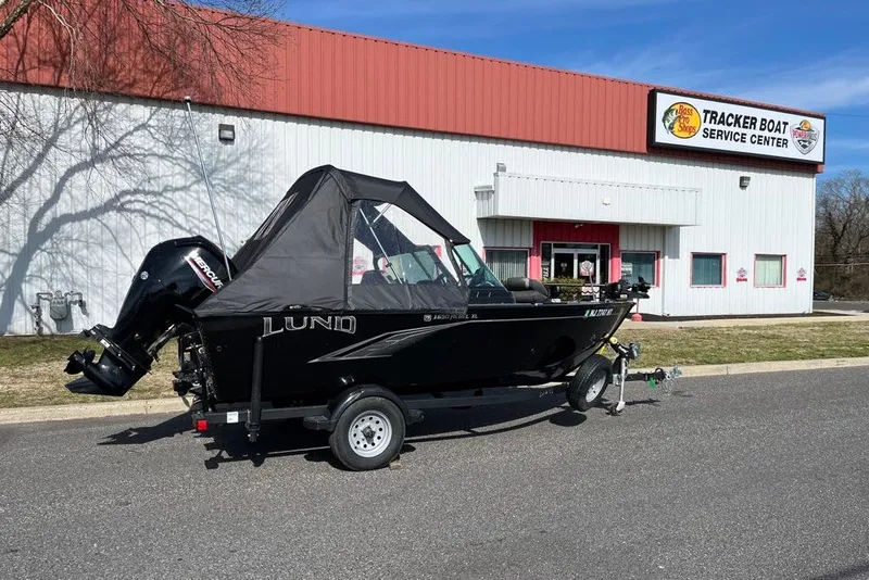 Slide: The Image of 2023 Lund 1650 Rebel XL Sport boat parked outside Tracker Boat Service Center. - 3