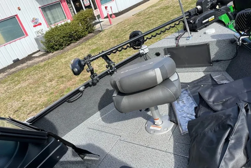 Slide: The Image of 2023 Lund 1650 Rebel XL Sport boat interior with seating and equipment. - 6