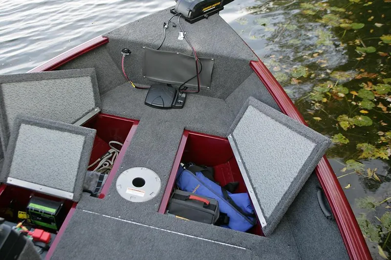 Slide: The Image of Manufacturer Provided Image: 2023 Lund 1650 Rebel XL Sport boat interior with open storage compartments. - 18