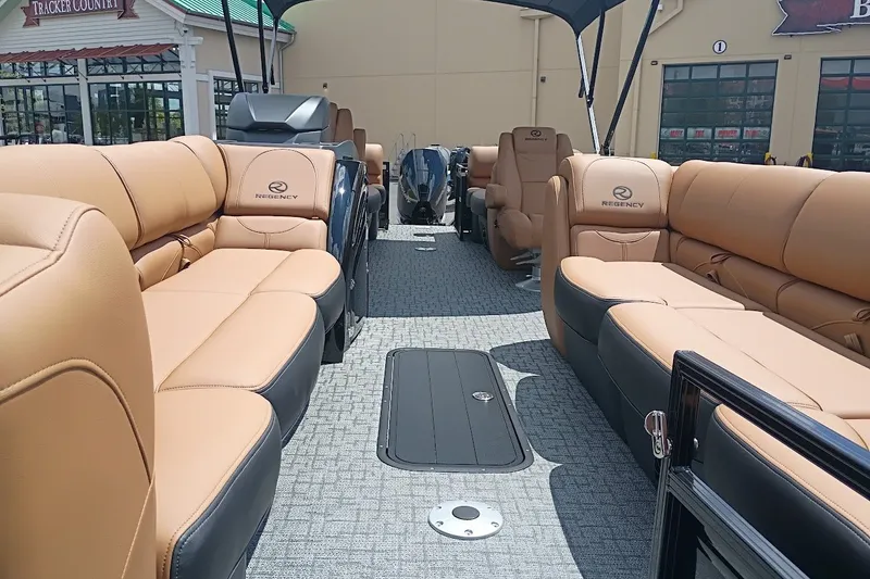 Slide: The Image of Luxurious 2027 Regency 250 DL pontoon boat with spacious seating and modern design. - 3