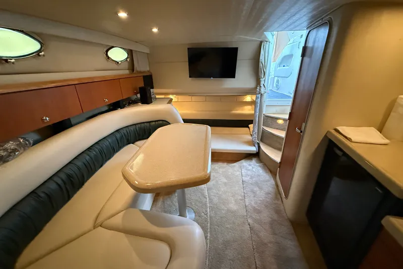 Slide: The Image of Interior of a 1998 Wellcraft 3200 Martinique yacht with cozy seating and modern amenities. - 52