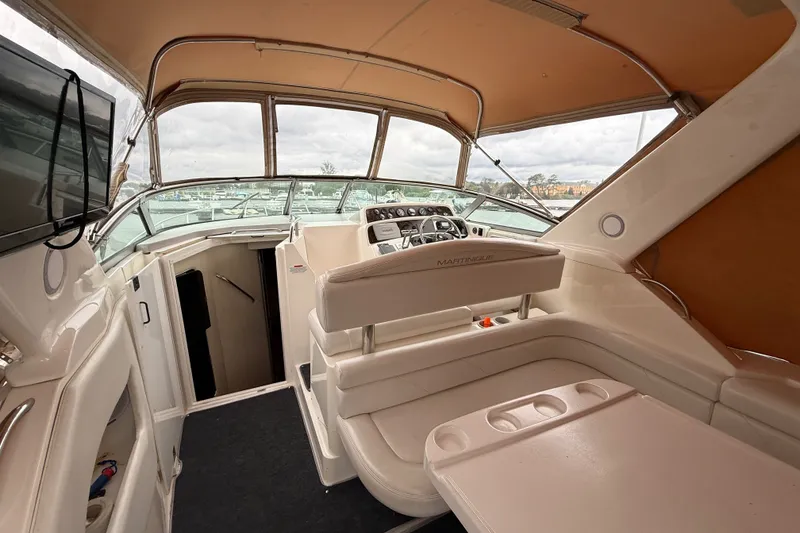 Slide: The Image of Interior view of a 1998 Wellcraft 3200 Martinique boat with seating and helm. - 10