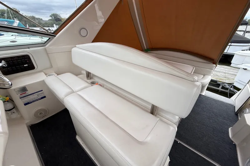 Slide: The Image of 1998 Wellcraft 3200 Martinique boat interior with white seating and control panel. - 30