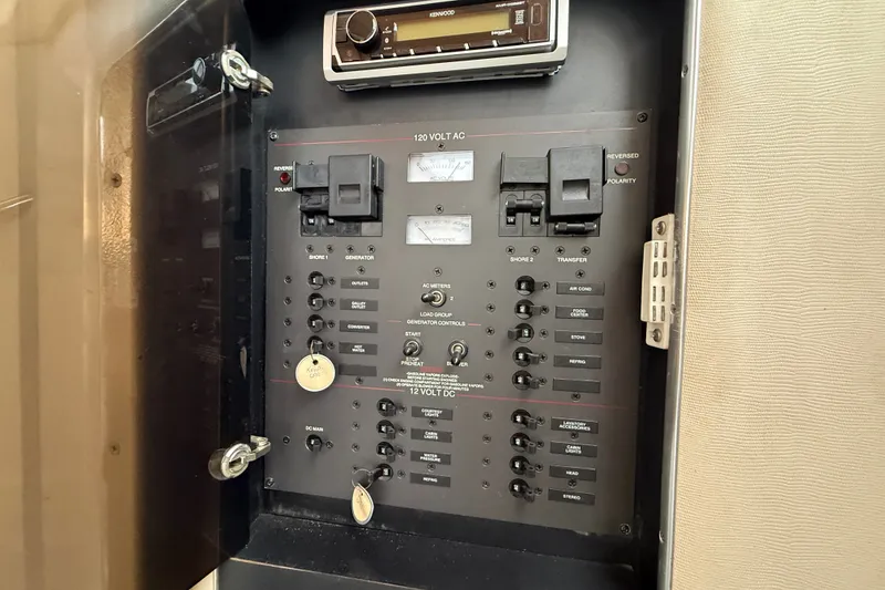 Slide: The Image of Electrical control panel on a 1998 Wellcraft 3200 Martinique boat. - 57