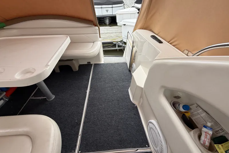 Slide: The Image of Interior of a 1998 Wellcraft 3200 Martinique boat with seating and table. - 15