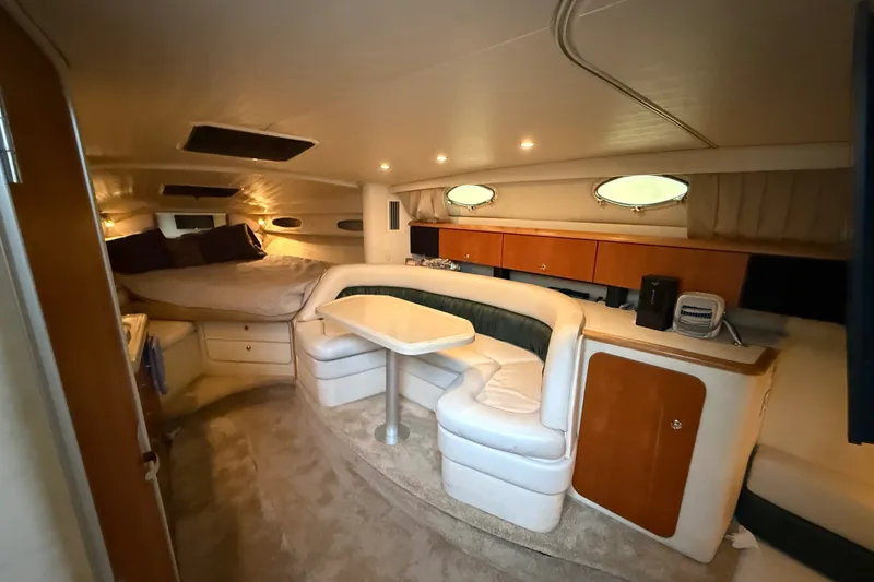 Slide: The Image of Interior of 1998 Wellcraft 3200 Martinique yacht with cozy seating and sleeping area. - 36