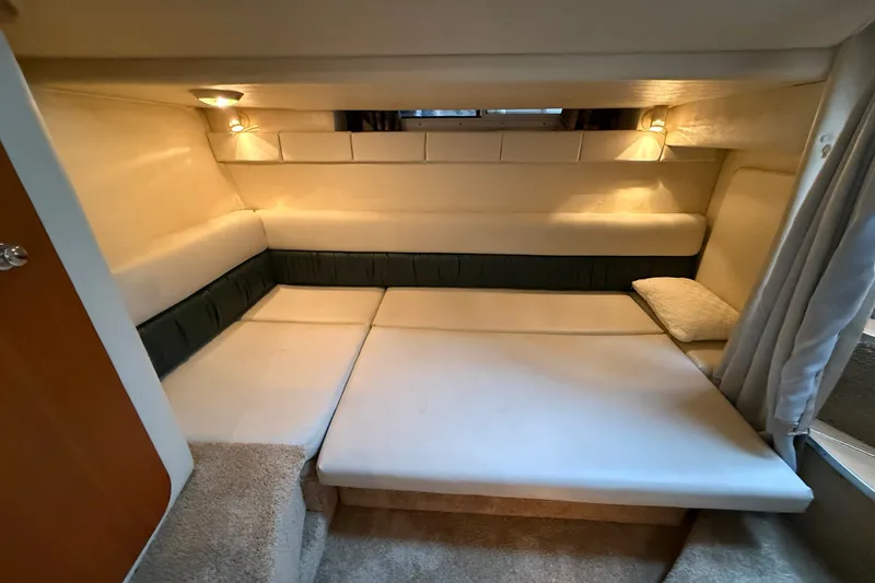 Slide: The Image of Interior cabin of 1998 Wellcraft 3200 Martinique boat with cozy seating and soft lighting. - 56