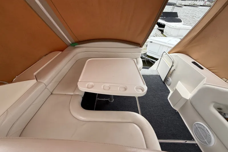 Slide: The Image of Interior of 1998 Wellcraft 3200 Martinique boat with seating and table. - 13