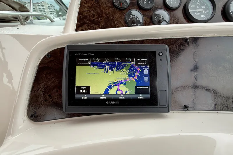 Slide: The Image of Garmin GPS on 1998 Wellcraft 3200 Martinique boat dashboard, displaying nautical map. - 24