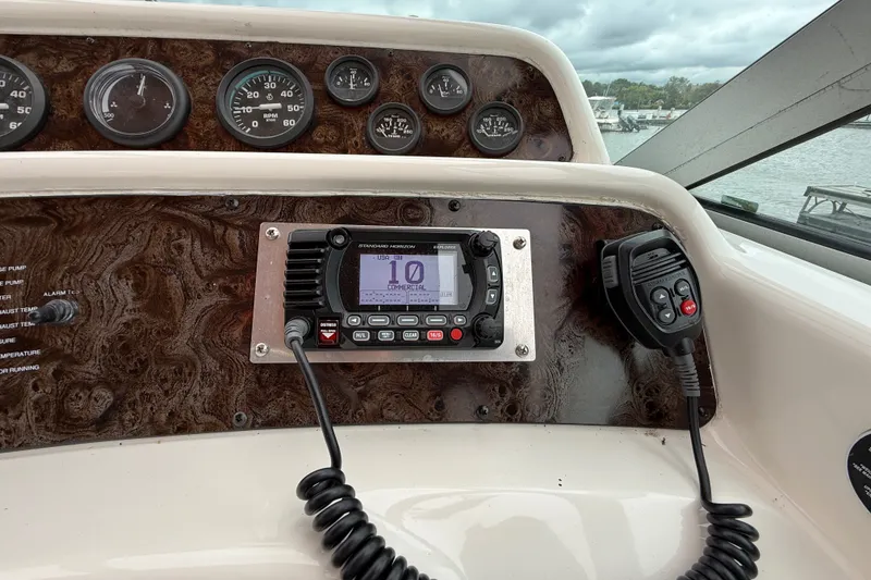 Slide: The Image of Dashboard of a 1998 Wellcraft 3200 Martinique boat with radio and gauges. - 25