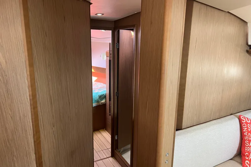 Slide: The Image of Interior view of 2013 Jeanneau Sun Odyssey 44 DS yacht cabin with wooden finish. - 18