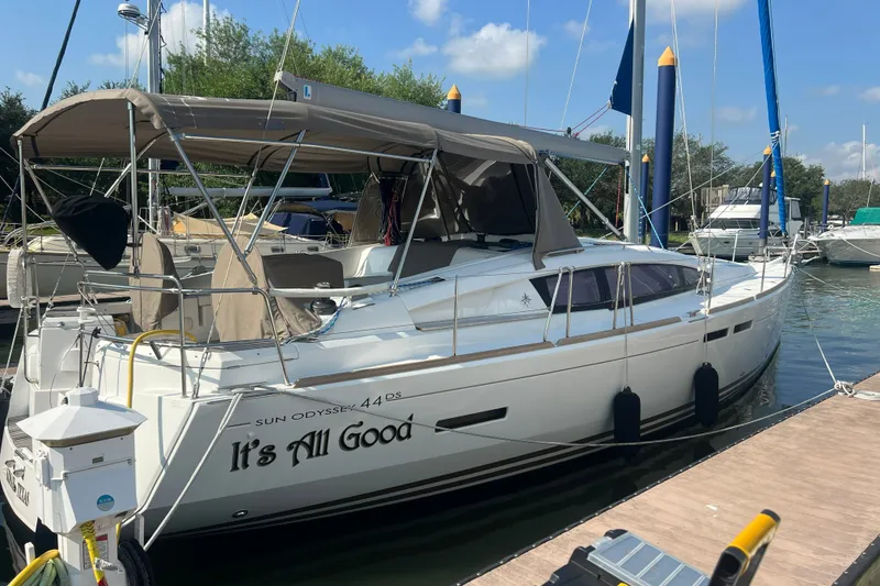 Slide: The Image of 2013 Jeanneau Sun Odyssey 44 DS sailboat docked, featuring sleek design and spacious deck. - 5