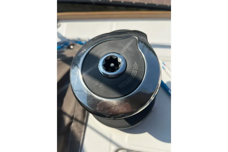 Slide: The Image of Close-up of a Harken winch on a 2013 Jeanneau Sun Odyssey 44 DS sailboat. - 32