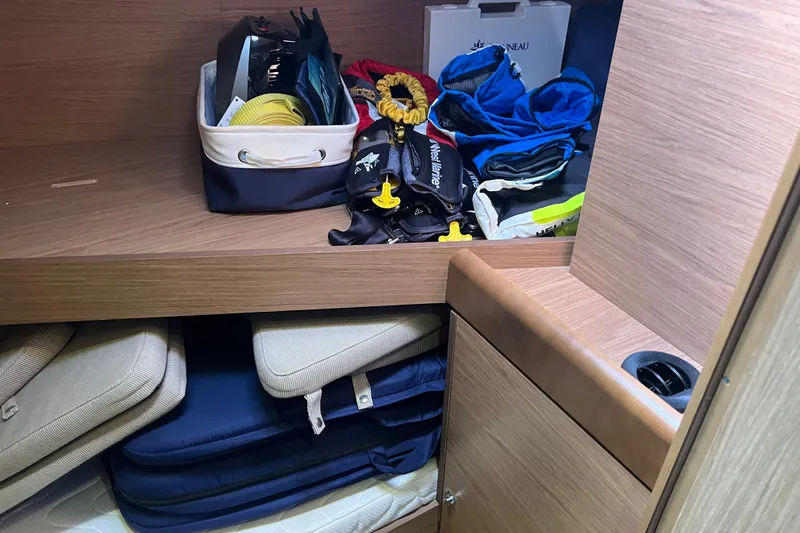 Slide: The Image of Storage area in a 2013 Jeanneau Sun Odyssey 44 DS yacht with organized gear and equipment. - 21