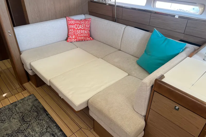 Slide: The Image of Interior of 2013 Jeanneau Sun Odyssey 44 DS with cozy seating and colorful cushions. - 25