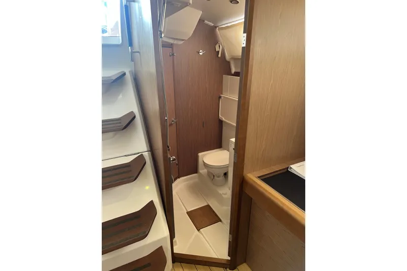 Slide: The Image of Interior of 2013 Jeanneau Sun Odyssey 44 DS yacht bathroom with wooden finish. - 16