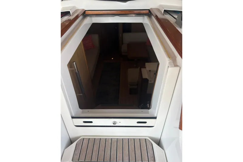 Slide: The Image of Cabin entrance of 2013 Jeanneau Sun Odyssey 44 DS sailboat, featuring sleek interior design. - 34