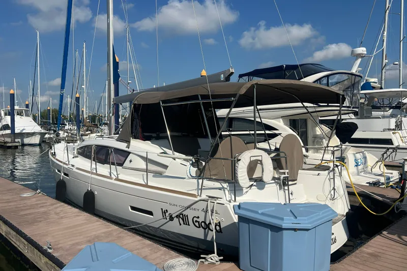 Slide: The Image of 2013 Jeanneau Sun Odyssey 44 DS sailboat docked at marina under clear blue sky. - 6