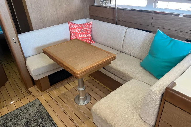Slide: The Image of Interior of 2013 Jeanneau Sun Odyssey 44 DS with cozy seating and colorful cushions. - 14