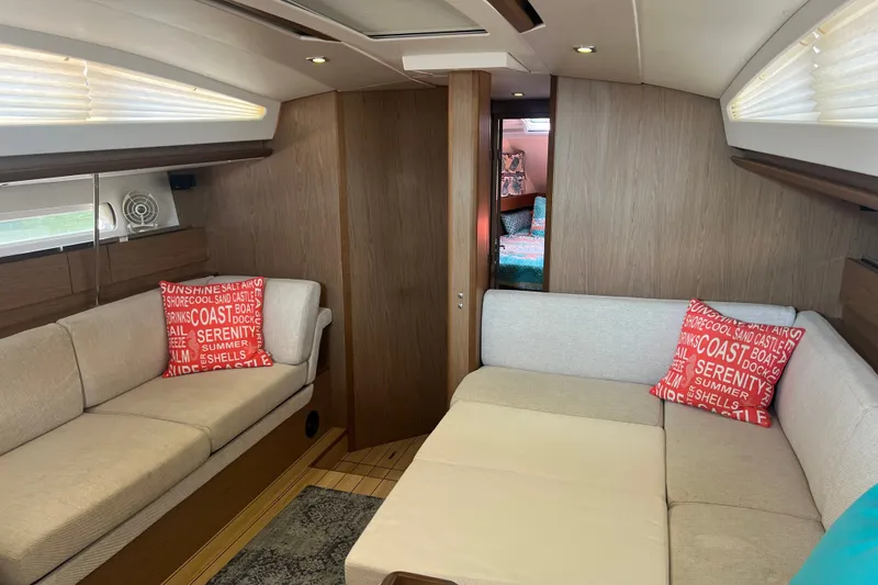Slide: The Image of Interior of 2013 Jeanneau Sun Odyssey 44 DS yacht with cozy seating and nautical decor. - 19