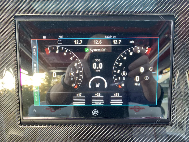 Slide: The Image of Dashboard display of a 2024 Fountain 38 SCX boat showing system status and gauges. - 26