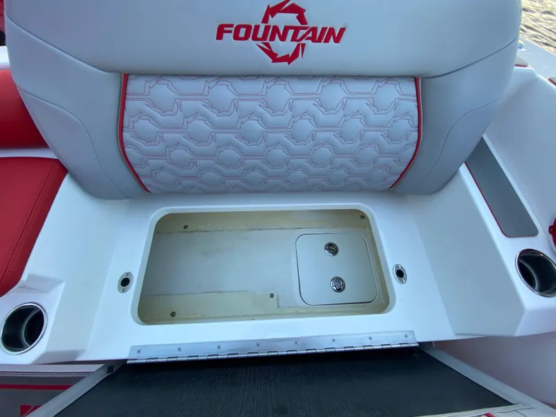 Slide: The Image of 2024 Fountain 38 SCX boat seat with storage compartment, white and red design. - 46