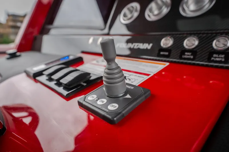 Slide: The Image of 2024 Fountain 38 SCX boat control panel with joystick and switches. - 58