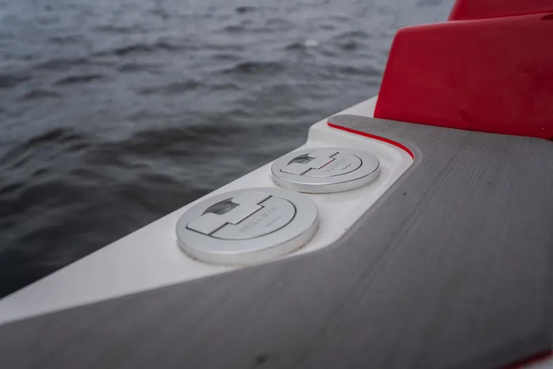 Slide: The Image of Close-up of 2024 Fountain 38 SCX boat deck details with water in background. - 56