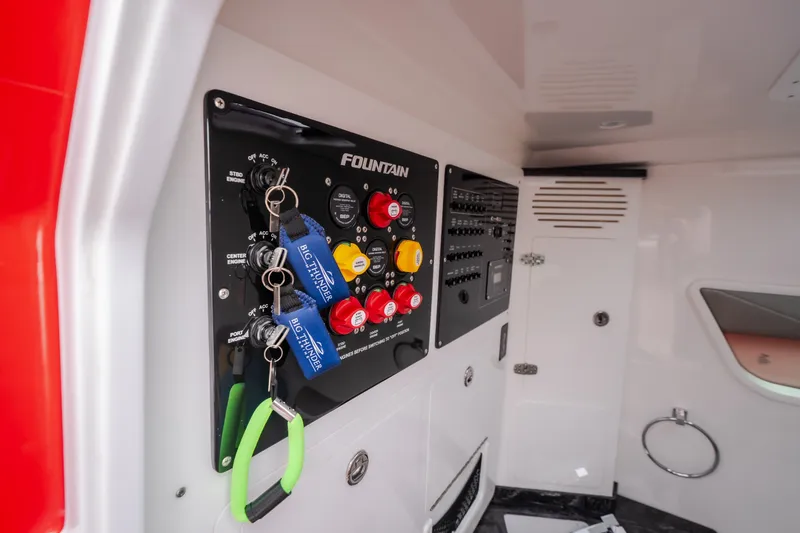 Slide: The Image of Control panel of 2024 Fountain 38 SCX boat with keys and switches. - 52
