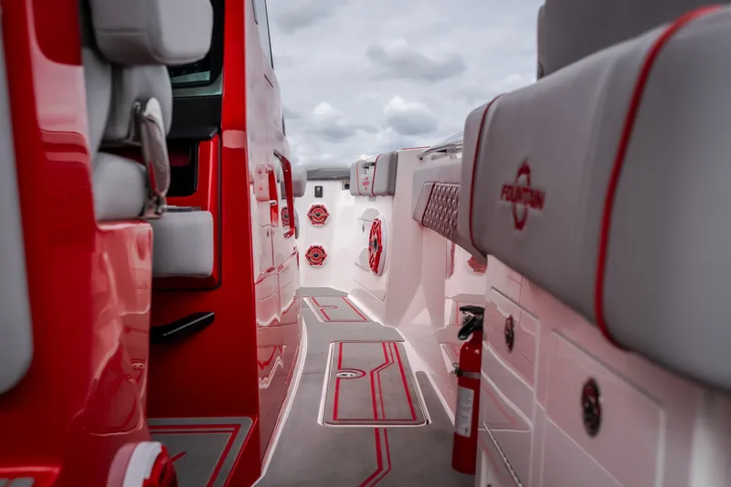 Slide: The Image of 2024 Fountain 38 SCX boat interior with red accents and seating, showcasing modern design. - 19