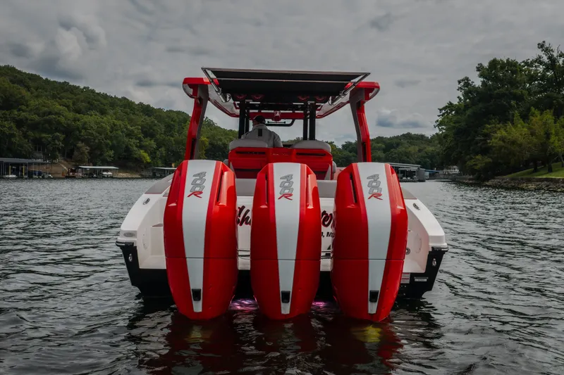 Slide: The Image of 2024 Fountain 38 SCX boat with triple 400R engines on a scenic lake. - 14