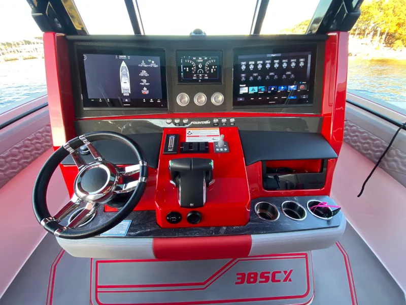 Slide: The Image of 2024 Fountain 38 SCX boat dashboard with modern controls and digital displays. - 12
