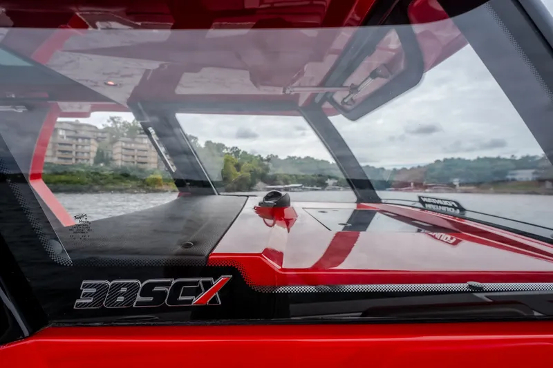 Slide: The Image of 2024 Fountain 38 SCX boat interior with sleek design and waterfront view. - 42
