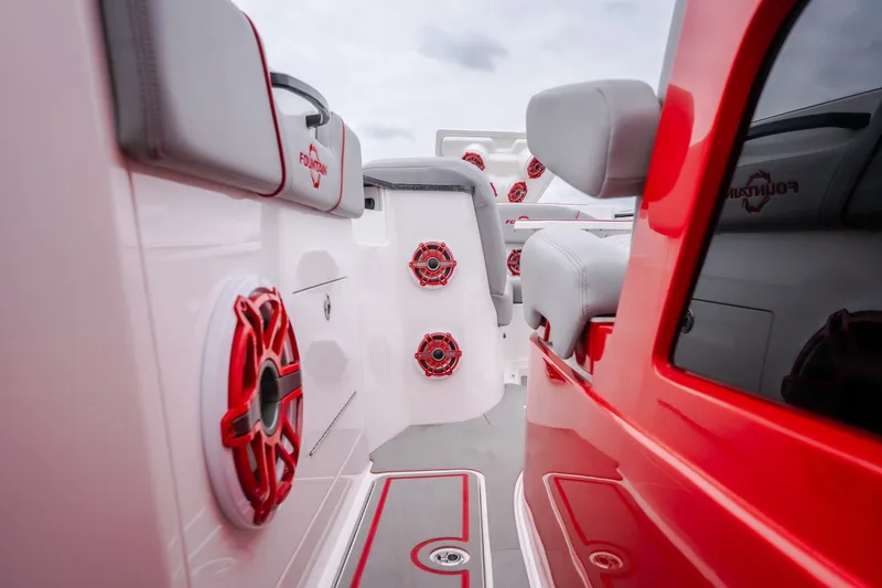 Slide: The Image of 2024 Fountain 38 SCX boat interior with red accents and modern seating design. - 67